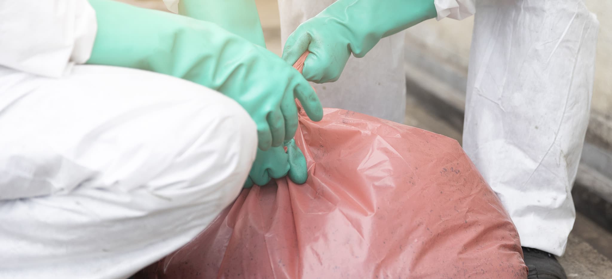 Workers disposing of hazardous fluids